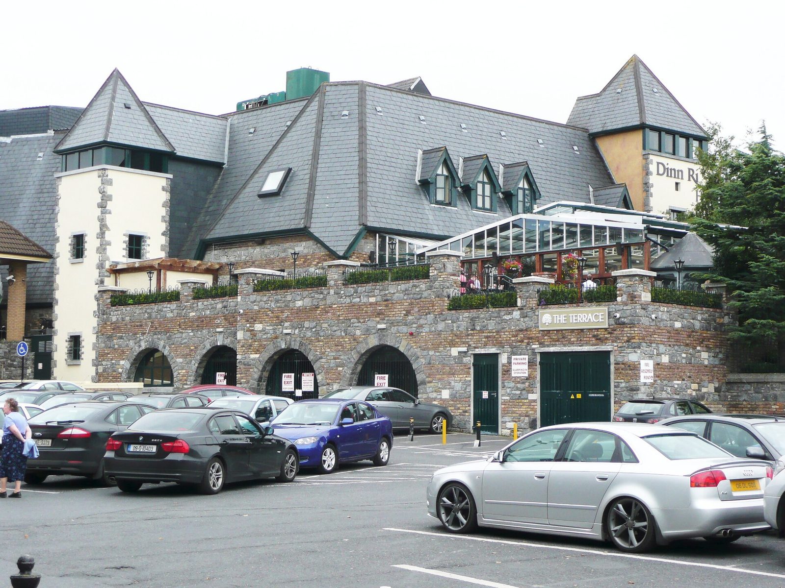 The Terrace at the Dinn Rí: a stone terrace with arches below the hotel roofs